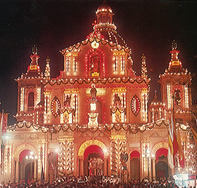 Brightly decorated church, festooned with lights