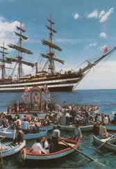 Fleet of boats with the statue going to sea