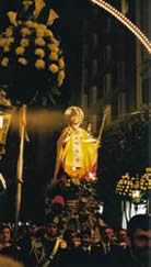 Lighted statue with flowers