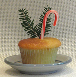 Cupcake with evergreen and candy cane
