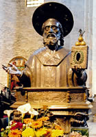 Half-figure holding relic box with three gold balls