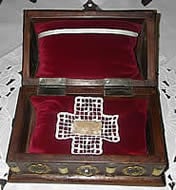 Open wooden chest, showing relic