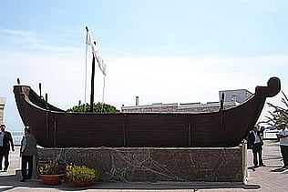 Large open boat with sail